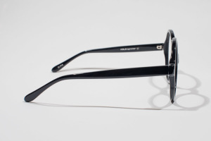 Temple view of big round glasses in shiny black by Kala Eyewear. American Made Glasses.