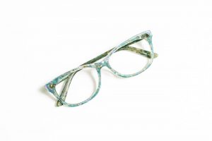 Cat eye floral glasses with pastel and light green.